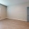 a room with a wood floor and a door