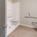 a bathroom with a toilet and a shower unit