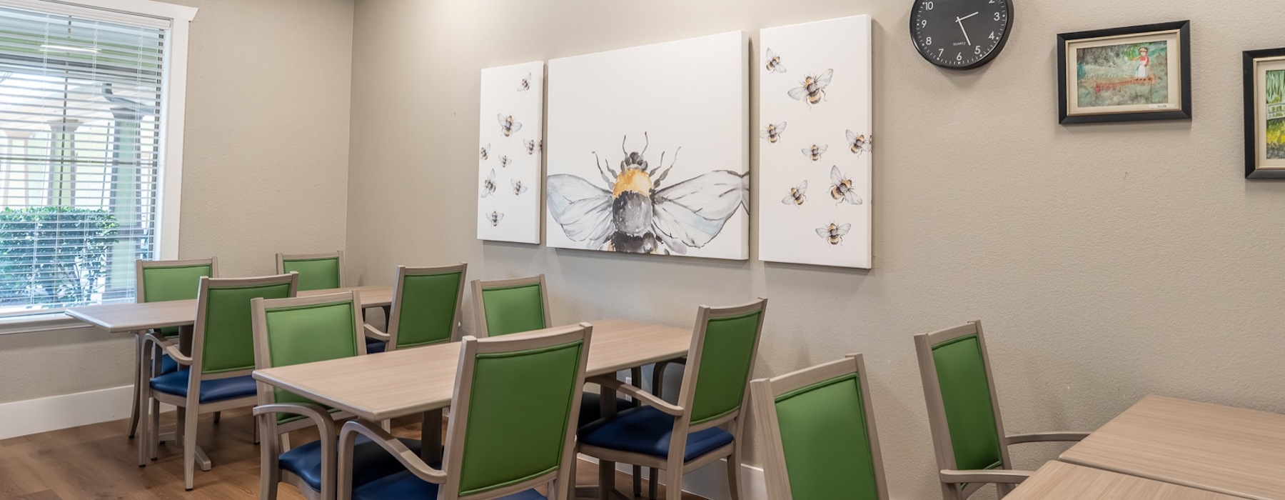 a dining and game hall with a large window