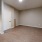 a room with wood cabinets and wood flooring